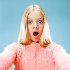 Image showing Beautiful teen girl looking suprised and bewildered