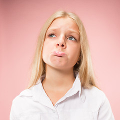 Image showing Beautiful teen girl looking sad and bewildered