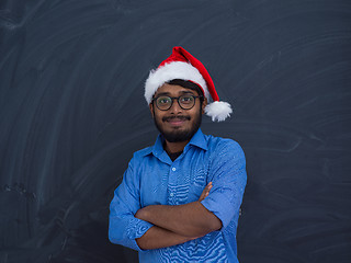 Image showing Indian man wearing traditional Santa Claus hat