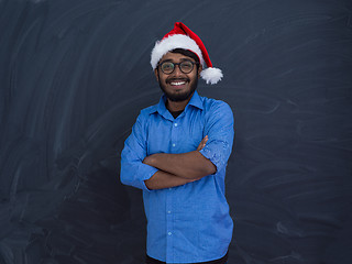 Image showing Indian man wearing traditional Santa Claus hat