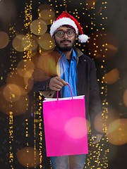 Image showing Indian Santa with shopping bags