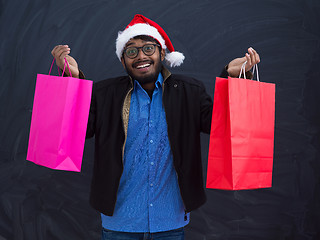 Image showing Indian Santa with shopping bags