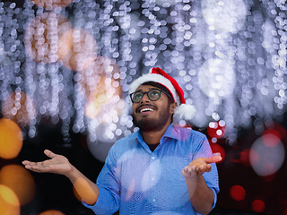 Image showing Indian man wearing traditional Santa Claus hat