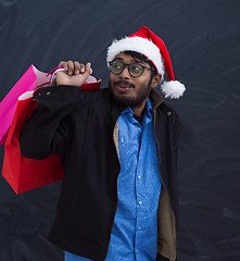 Image showing Indian Santa with shopping bags