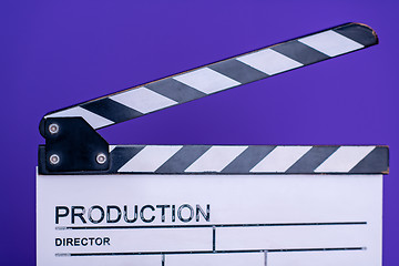 Image showing movie clapper on purple violet background