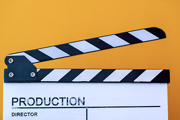 Image showing movie clapper isolated on yellow background