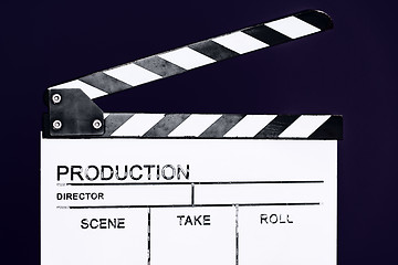 Image showing movie clapper on purple violet background