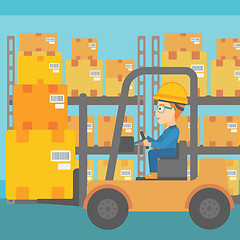 Image showing Warehouse worker moving load by forklift truck.