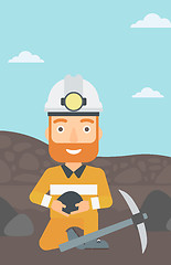 Image showing Miner holding coal in hands.