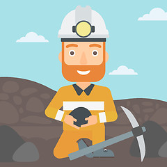 Image showing Miner holding coal in hands.