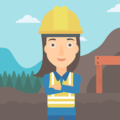 Image showing Miner with mining equipment on background.