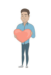 Image showing Hispanic businessman holding a big red heart.