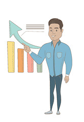 Image showing Young hispanic businessman pointing at chart.