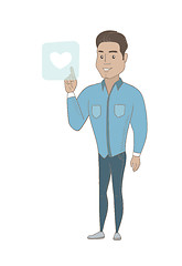 Image showing Young businessman pressing web button with heart.