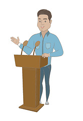 Image showing Hispanic politician giving a speech from tribune.