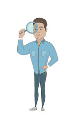 Image showing Young hispanic businessman with magnifying glass.