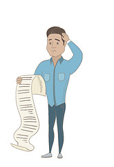 Image showing Young hispanic accountant holding a long bill.