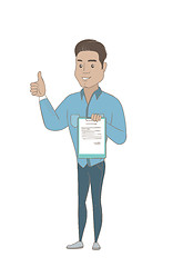 Image showing Young businessman with clipboard giving thumb up.