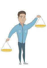 Image showing Hispanic businessman holding balance scale.