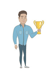 Image showing Young hispanic businessman holding a trophy.