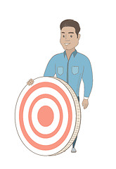 Image showing Young hispanic businessman and dart board.