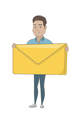 Image showing Young hispanic businessman holding big envelope.