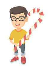 Image showing Caucasian little boy holding christmas candy cane.