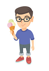 Image showing Little caucasian boy holding an ice cream cone.