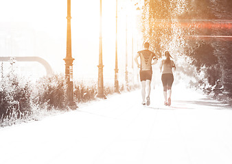 Image showing young couple jogging  in the city