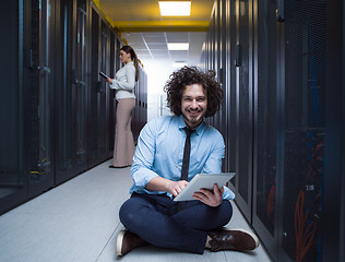 Image showing young technicians working together on servers