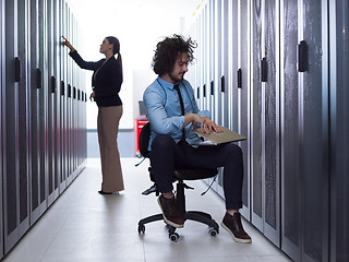 Image showing technicians working together on servers