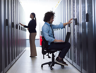 Image showing technicians working together on servers