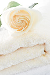 Image showing Stack of towels and rose