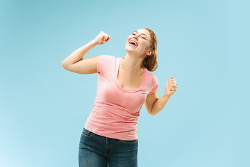 Image showing Winning success woman happy ecstatic celebrating being a winner. Dynamic energetic image of female model