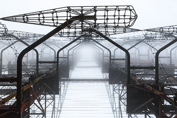 Image showing Large radar antenna in the fog