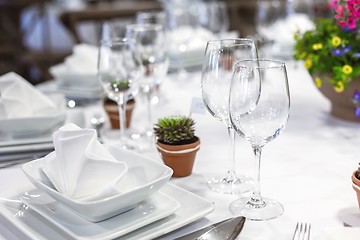 Image showing Plates and dishes on dining table