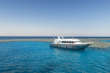 Image showing Luxury yacht docking near coral reef