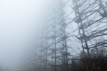 Image showing Large radar antenna in the fog