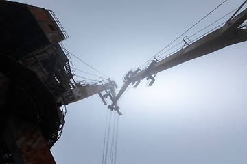 Image showing Rusty old industrial dock cranes at the Dock