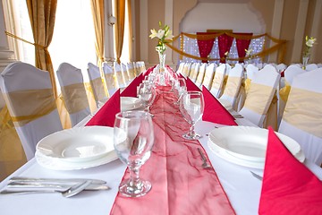 Image showing Plates and dishes on dining table