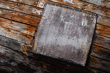 Image showing Peeling brown plank background texture