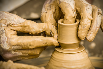 Image showing Modeling on a potter`s wheel