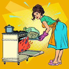 Image showing Woman housewife bakes bird in the oven