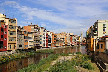 Image showing Colorful houses and Eiffel bridge on river Onyar in Girona