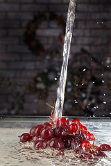 Image showing Bunch Of Grapes And Water Stream