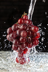 Image showing Bunch Of Grapes And Water Stream