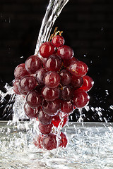 Image showing Bunch Of Grapes And Water Stream