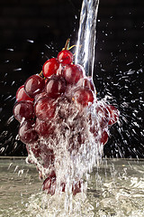 Image showing Bunch Of Grapes And Water Stream