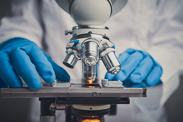 Image showing Close-up shot of microscope with metal lens at laboratory.