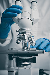 Image showing Close-up shot of microscope with metal lens at laboratory.